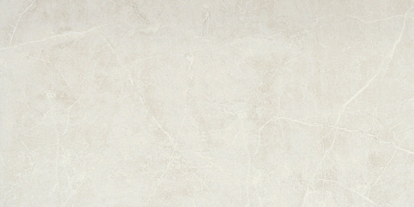 The Callie 12x24 Matte Porcelain Tile in Steel features a smooth, elegant matte finish with subtle white veining and a natural stone texture for a minimalist look.