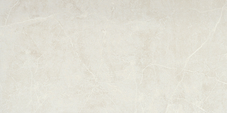 Callie 12x24 Polished Porcelain Tile in Steel offers a smooth surface, fine lines, and soft gray tones with subtle veining, delivering an elegant natural stone look.