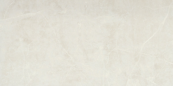 Callie 12x24 Polished Porcelain Tile in Steel offers a smooth surface, fine lines, and soft gray tones with subtle veining, delivering an elegant natural stone look.