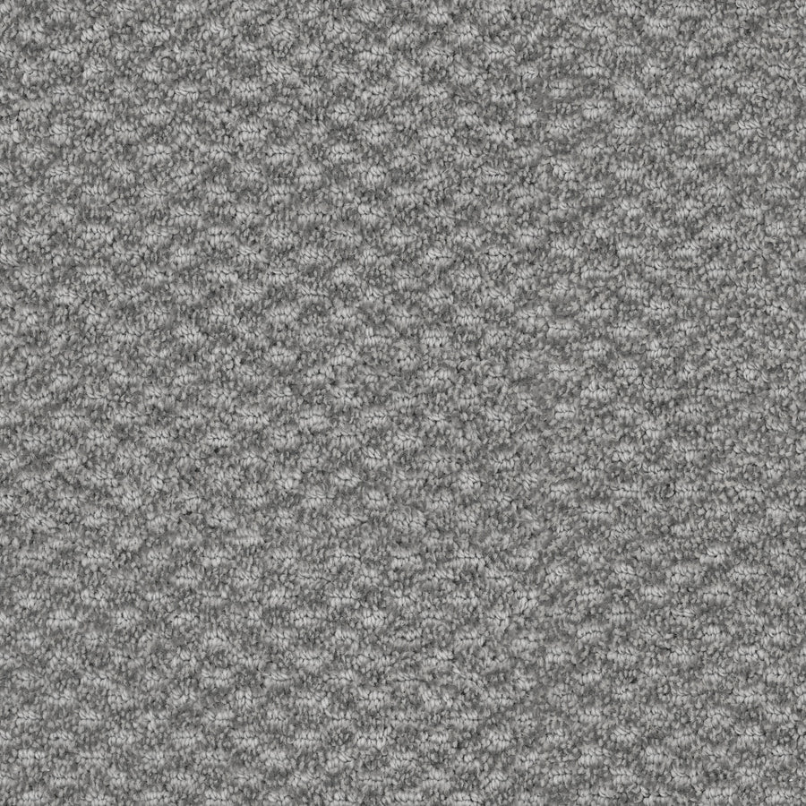 Close-up of Calm Pet Friendly Carpet in gray, featuring a tightly woven, looped texture with a raised diamond pattern—offering a soft, structured, and durable surface ideal for homes with pets.
