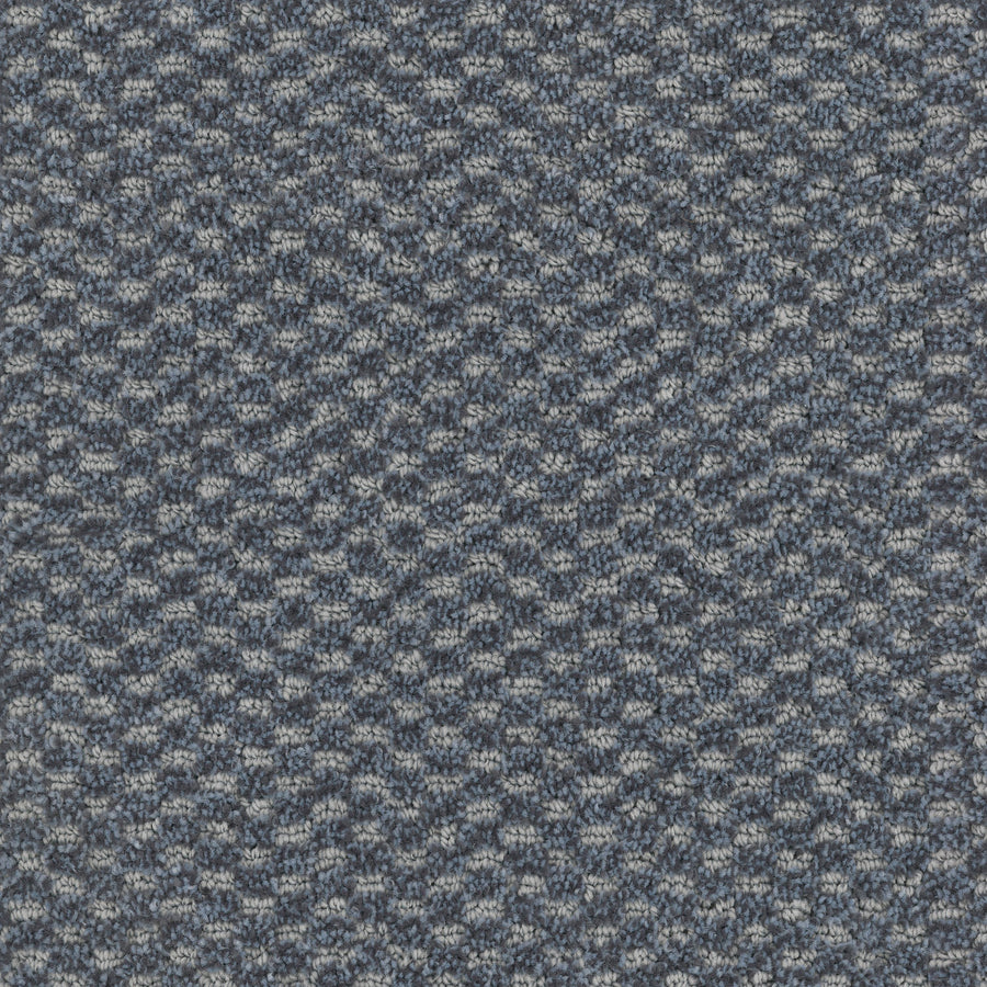 Close-up of Calm Pet Friendly Carpet, featuring a textured blue and gray woven pattern. This luxury carpet is perfect for pet owners wanting stylish, durable flooring for their living spaces.