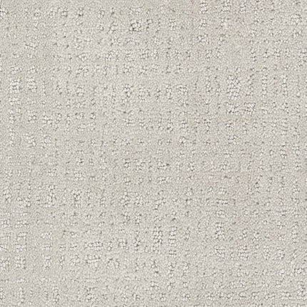 Homage Berber Carpet in Canberra features light grey textured fabric with a subtle grid-like pattern of small raised dots and lines. Its modern, tactile look is perfect for high-traffic areas, offering style and durability.