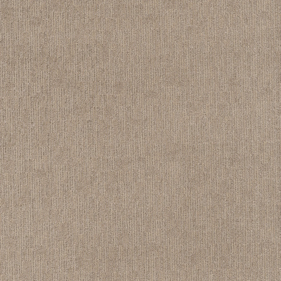 A close-up of Sneak Peak Berber Carpet in Canyon Dust showcases its dense pile and subtle vertical linear patterns, offering a soft, uniform appearance that's ideal for durable flooring.