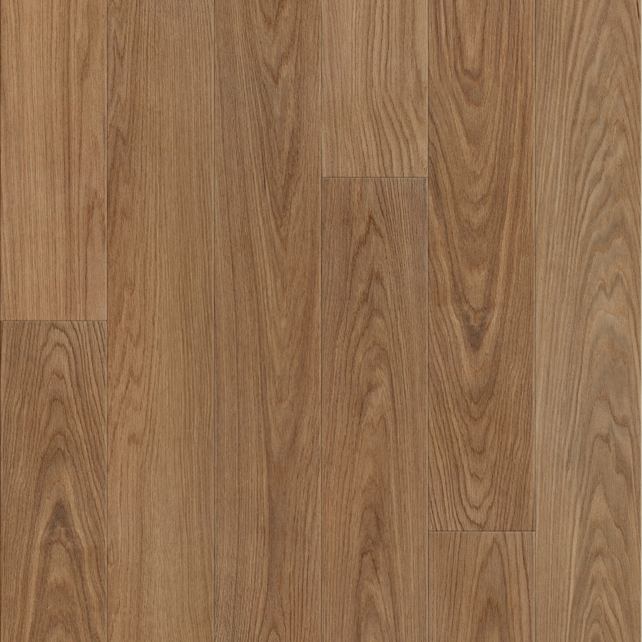 Close-up of Coretec Lakehouse Luxe 7.09" Vinyl Plank in Canyon Oak, showcasing a natural light brown finish with distinct wood grain patterns for a classic hardwood look.