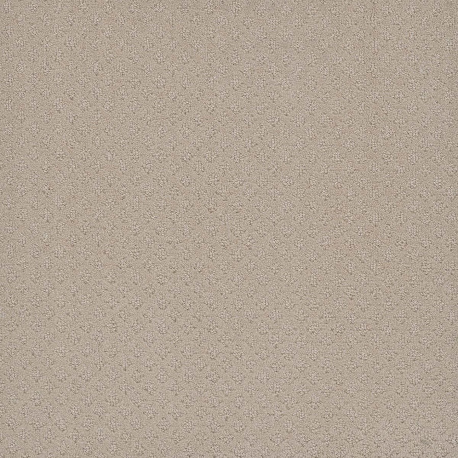 Close-up of Capri Pet Friendly Carpet in Champagne Fizz. The beige surface features a soft, stain resistant texture and a subtle repeating diamond pattern, with slight shading variations adding depth to the durable design.