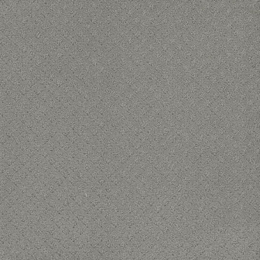 A close-up of Capri Pet Friendly Carpet in Icefield color, showcasing its textured gray surface with a repeating diamond pattern and subtle woven look.