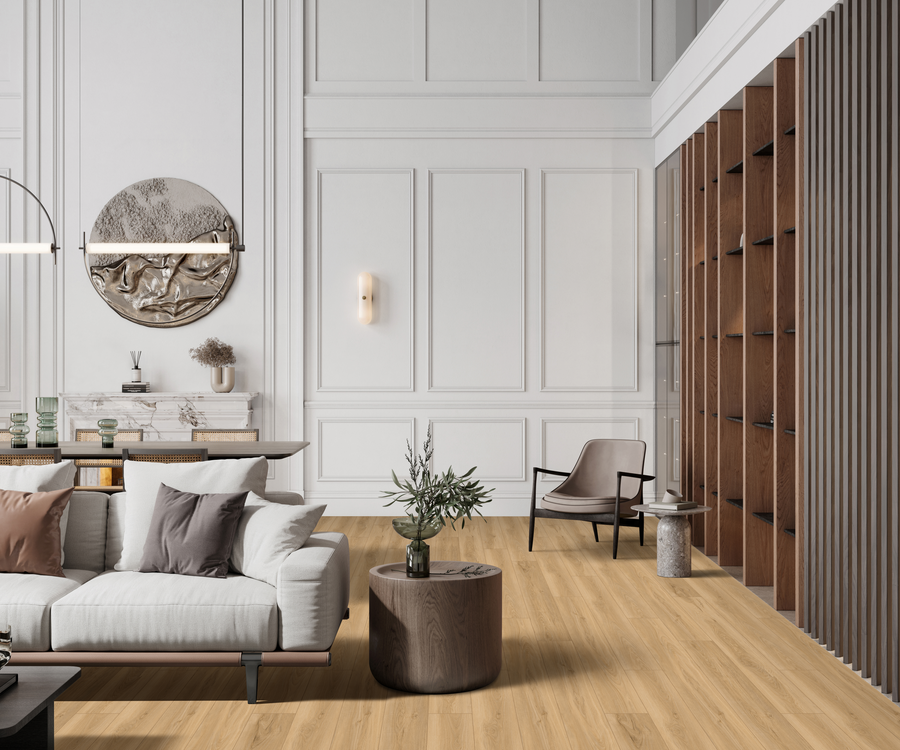 Modern living room with a white sofa, neutral throw pillows, wooden coffee table, armchair, large wall mirror, decorative vases, built-in shelves, wood flooring, white paneled walls, and minimalist decor.
