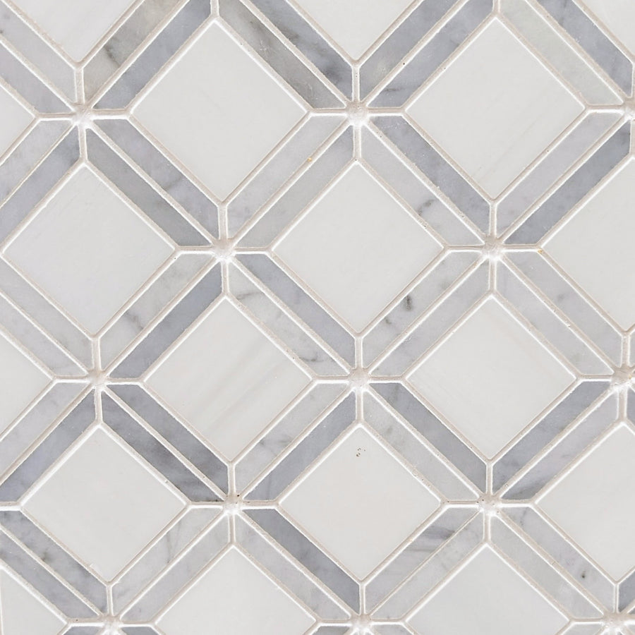 The Casella Polished Marble Mosaic Tile features a white and light gray Carrara marble pattern with diamond and square shapes, outlined by thin grout lines for a modern, geometric look.
