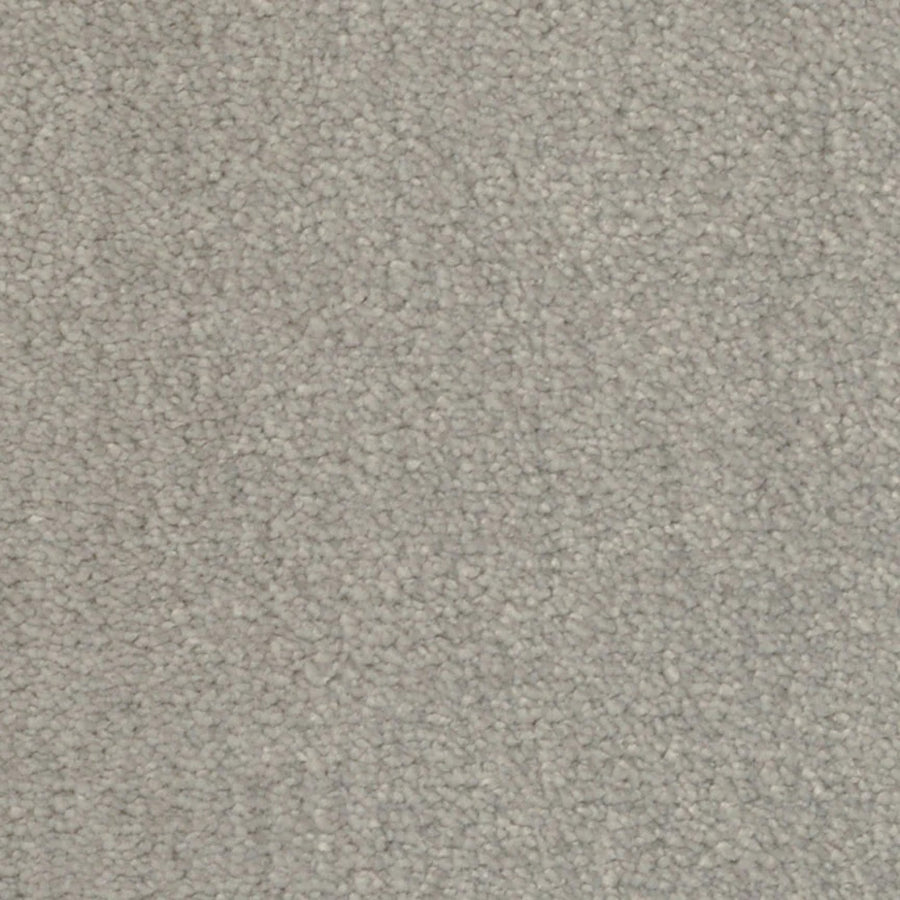 Close-up view of Seduction On Trend Carpet in Cashmere, featuring a light gray textured looped pile for a uniform, soft look—ideal for those seeking elegant and durable flooring.