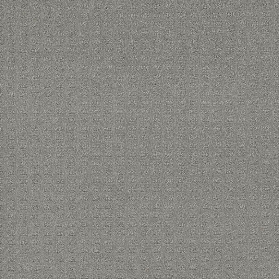 A close-up of Caspian Berber Carpet in Icefield shows its gray textured surface with a fine square grid pattern, crafted from premium fibers for enhanced durability.