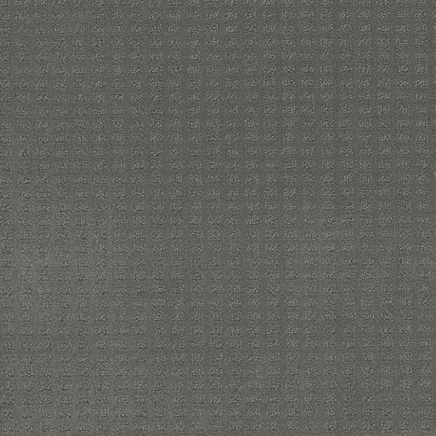 Close-up of Caspian Berber Carpet in Skyway color, showcasing a neutral gray surface with a subtle grid pattern of small, raised squares for a modern, monochromatic look.