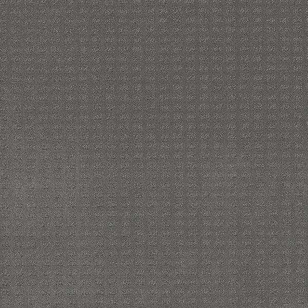 Close-up of Caspian Berber Carpet in Skyway color, showcasing a neutral gray surface with a subtle grid pattern of small, raised squares for a modern, monochromatic look.