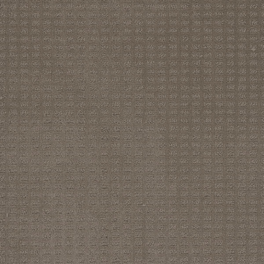 Close-up of the Caspian Berber Carpet in Topaz, featuring a subtle square grid pattern for a tactile feel. The muted, consistent color is achieved with premium fibers, ensuring lasting quality and a stylish textured surface.
