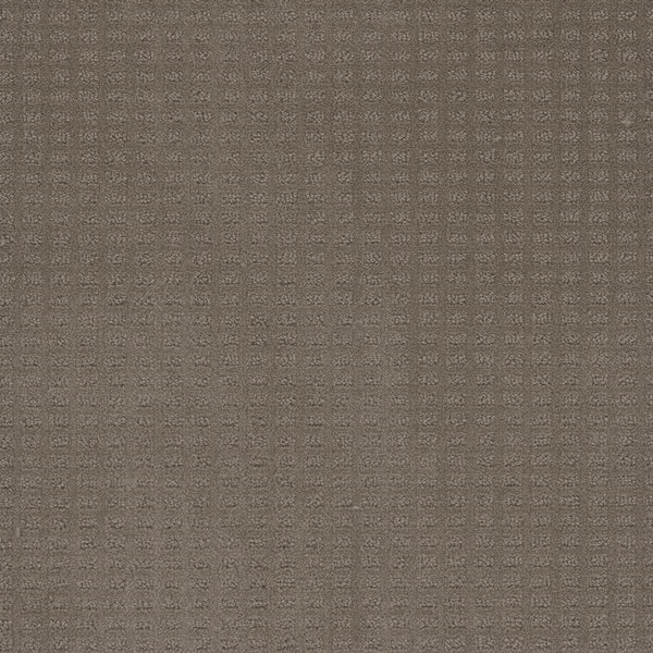 Close-up of the Caspian Berber Carpet in Topaz, featuring a subtle square grid pattern for a tactile feel. The muted, consistent color is achieved with premium fibers, ensuring lasting quality and a stylish textured surface.