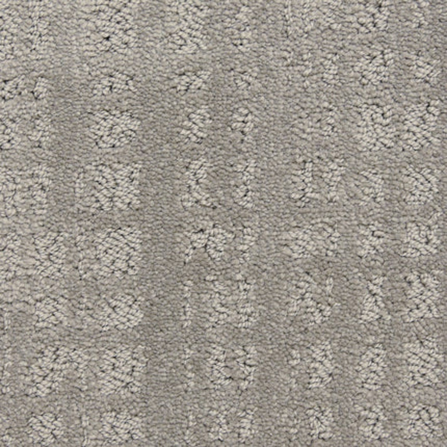 Close-up of the Willow Lake On Trend Carpet in Castle Rock—a textured gray luxury carpet featuring a subtle, raised geometric pattern of small squares and rectangles. Ideal for high-traffic areas, it delivers a soft yet structured look.