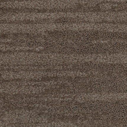 Close-up of Cirrus Berber Carpet in Cedar color, featuring a textured surface with wavy, horizontal patterns and a mottled brown and gray appearance that resembles natural stone. The look is rough and uneven, ideal for premium flooring.