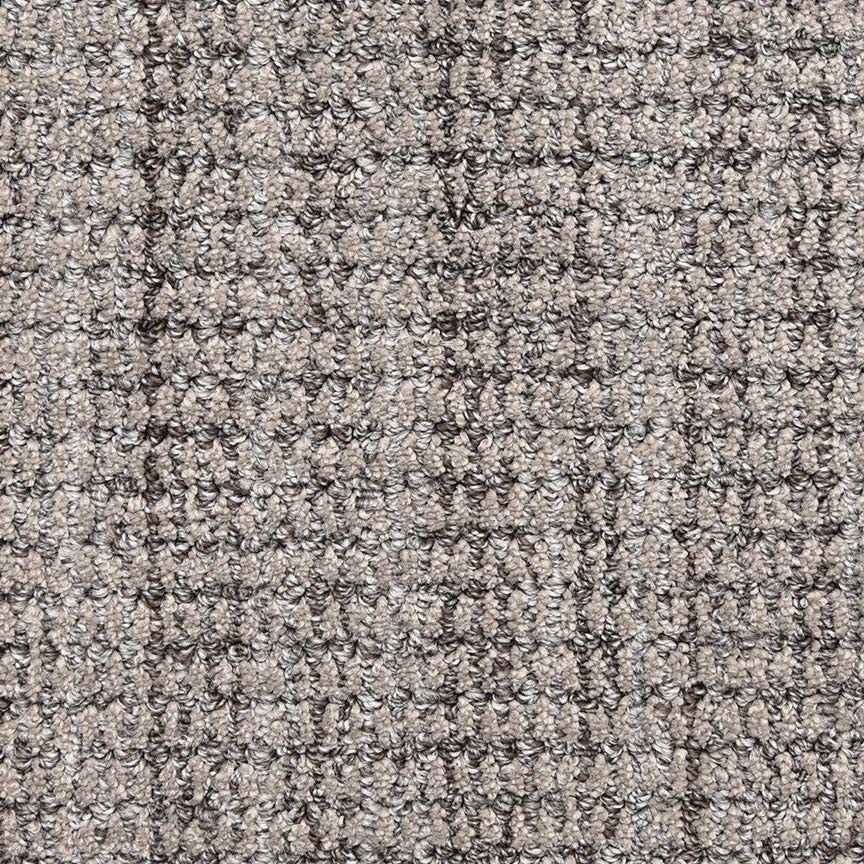 Close-up of Aspen Berber Carpet in charcoal, highlighting its textured, looped surface with a subtle checkered pattern that is slightly rough yet durable.