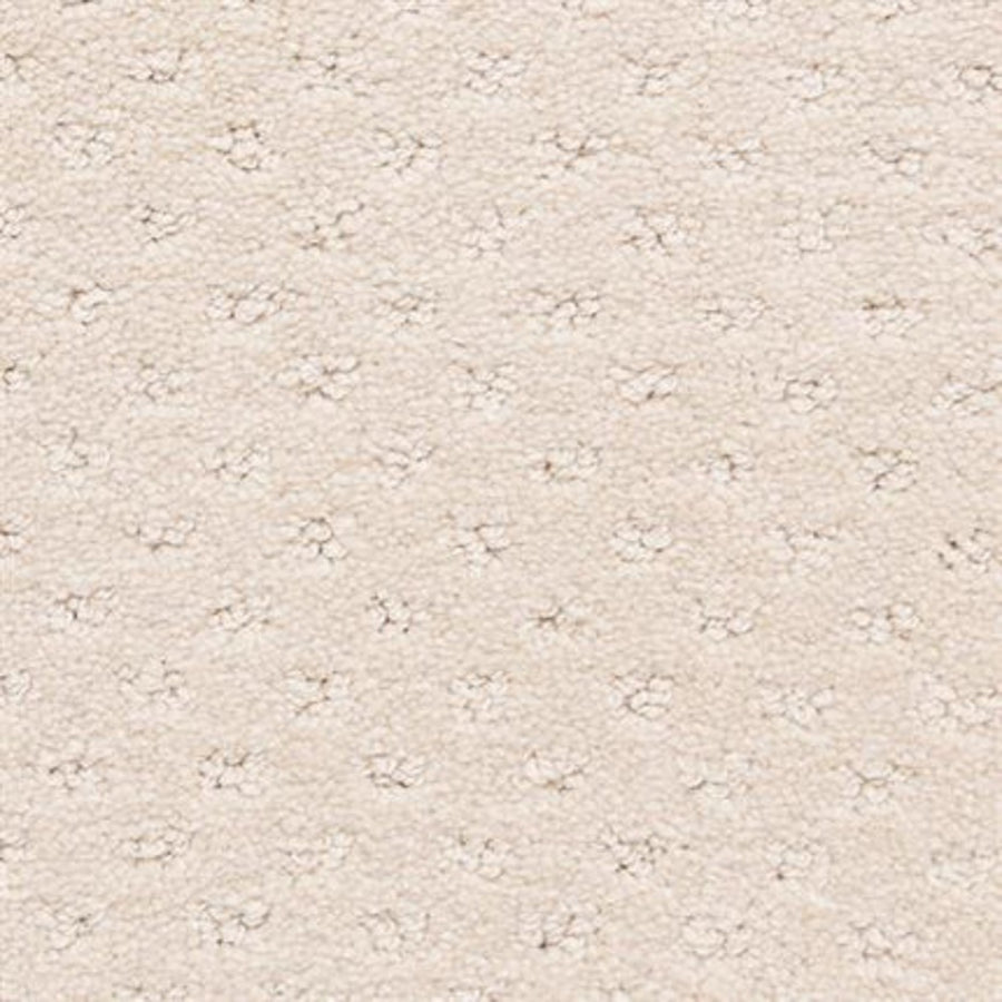 Close-up of Dreamer On Trend Carpet in Chiffon—a cream-colored, textured carpet with plush fibers and subtle dotted pattern. The soft, luxurious surface features small, evenly spaced indentations—ideal for luxury flooring.