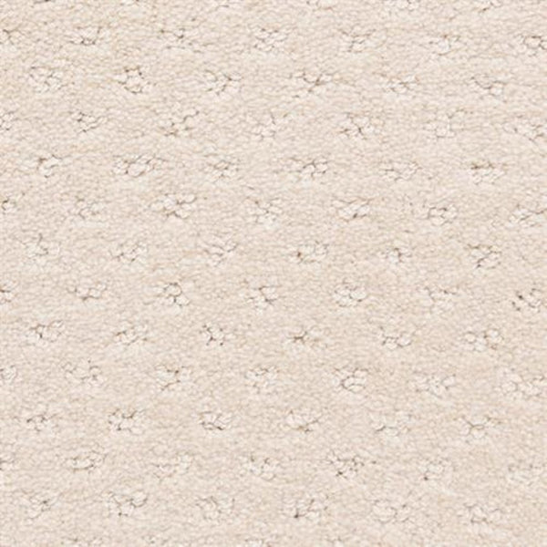 Close-up of Dreamer On Trend Carpet in Chiffon—a cream-colored, textured carpet with plush fibers and subtle dotted pattern. The soft, luxurious surface features small, evenly spaced indentations—ideal for luxury flooring.