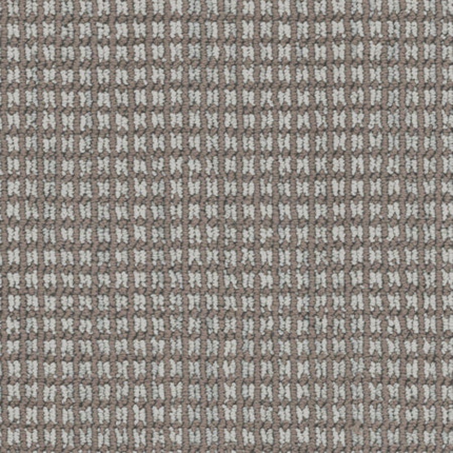 Close-up of Haven Berber Carpet in Chinchilla color shows a soft, durable surface with a textured grid pattern. Brown and white threads create a checkered, waffle-like look reminiscent of classic Berber design.