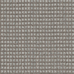 Close-up of Haven Berber Carpet in Chinchilla color shows a soft, durable surface with a textured grid pattern. Brown and white threads create a checkered, waffle-like look reminiscent of classic Berber design.