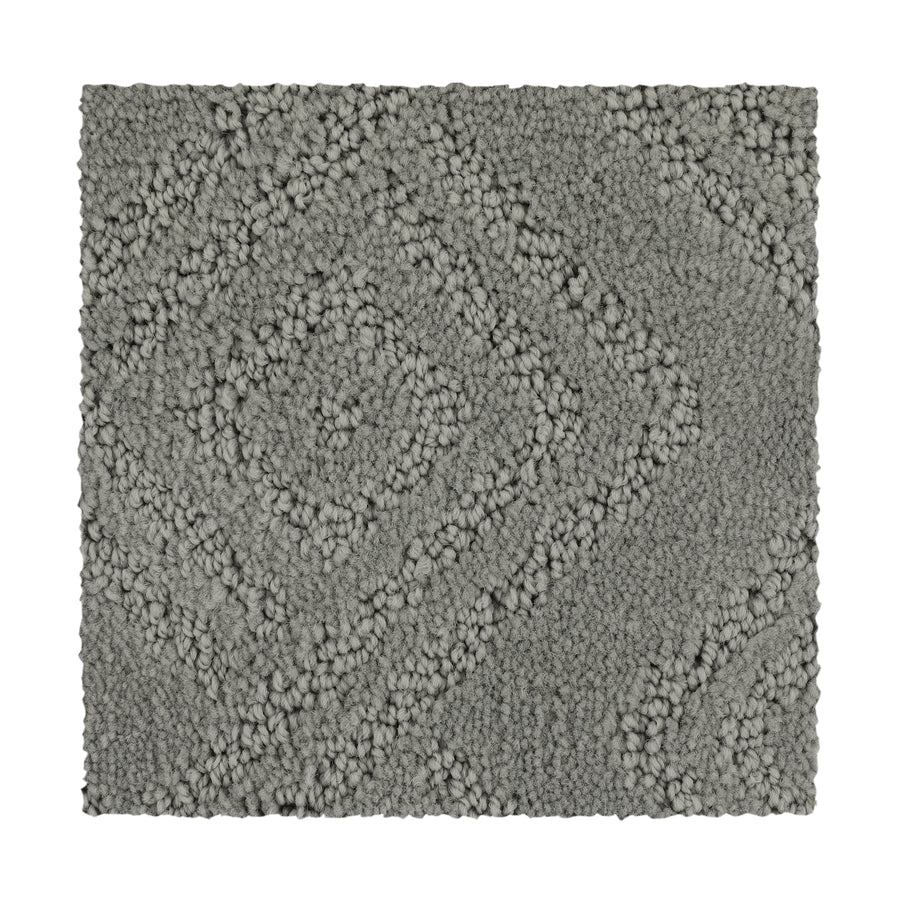 The Classic Frame Family Friendly Carpet in Classic color features a rectangular shape with a textured, raised diamond pattern of looped and tufted fibers for a soft, plush look. Shown against a plain white background.