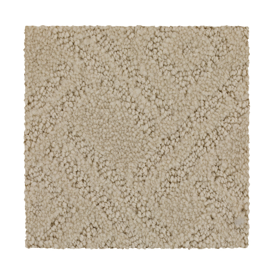 The Classic Frame Family Friendly Carpet in Harvest Moon features a textured, soft beige surface with a raised geometric pattern, offering plush comfort and durability—ideal for family spaces.