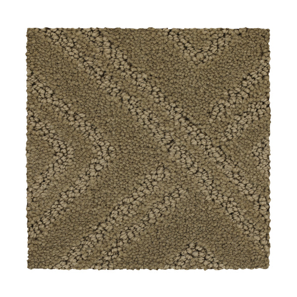 Classic Frame Family Friendly Carpet in Rum Cream features a textured, tan square swatch with a raised crisscross pattern and thick looped fibers for a plush, stylish, and family-friendly look.