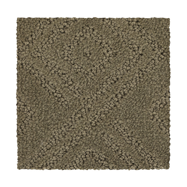 A rectangular swatch of Classic Frame Family Friendly Carpet in Driftwood, featuring a textured surface with a raised diamond and X pattern.