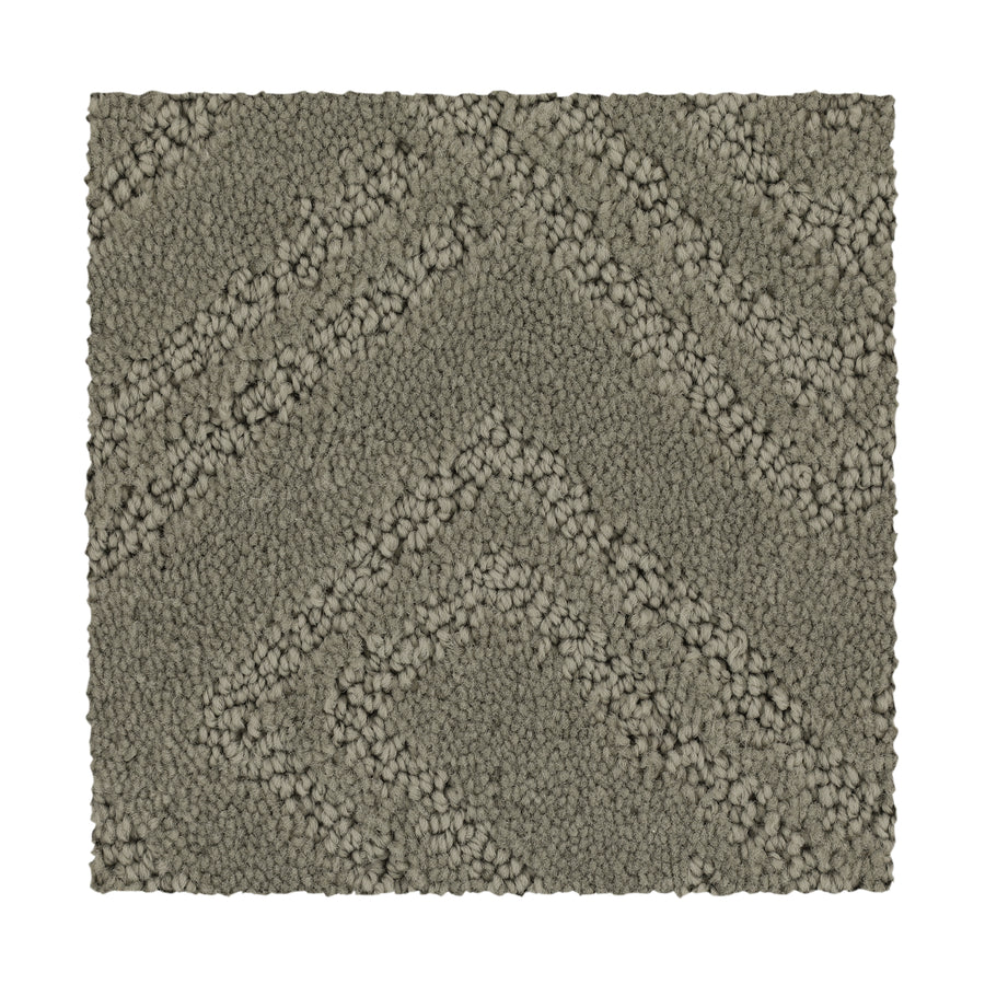 The Classic Frame Family Friendly Carpet in Soft Feather is a rectangular, textured, durable carpet with a raised chevron pattern featuring alternating smooth and looped fibers.