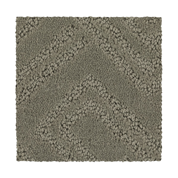 The Classic Frame Family Friendly Carpet in Soft Feather is a rectangular, textured, durable carpet with a raised chevron pattern featuring alternating smooth and looped fibers.