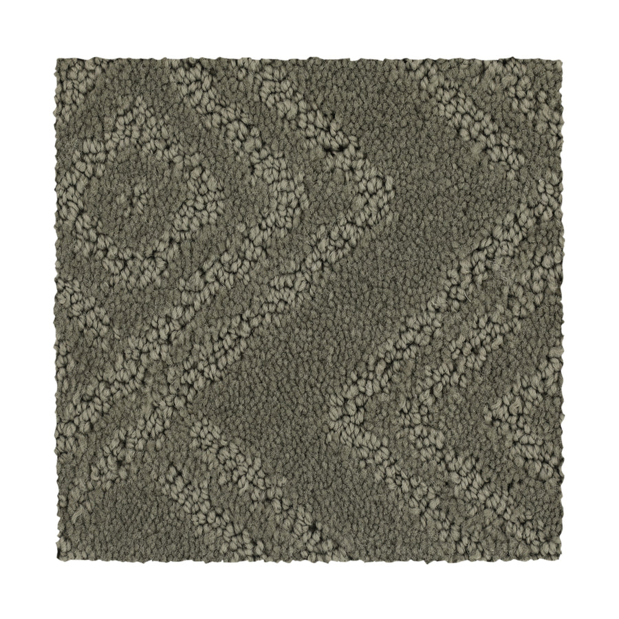 The Classic Frame Family Friendly Carpet in Briar Root is a rectangular, durable swatch with a raised geometric pattern of diagonal lines and diamond shapes.