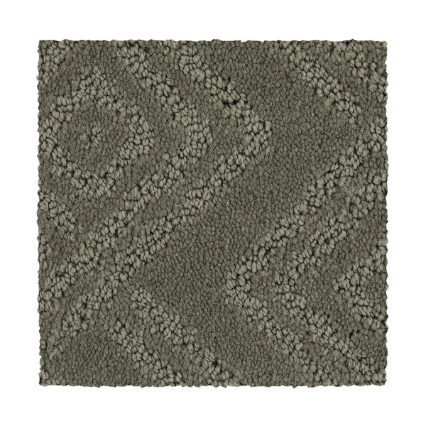 The Classic Frame Family Friendly Carpet in Briar Root is a rectangular, durable swatch with a raised geometric pattern of diagonal lines and diamond shapes.