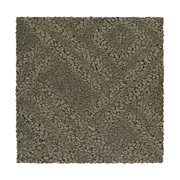 Classic Frame Family Friendly Carpet in Earth Tone features a textured, durable rectangular swatch with a raised geometric pattern of diagonal and intersecting lines—ideal for family spaces.