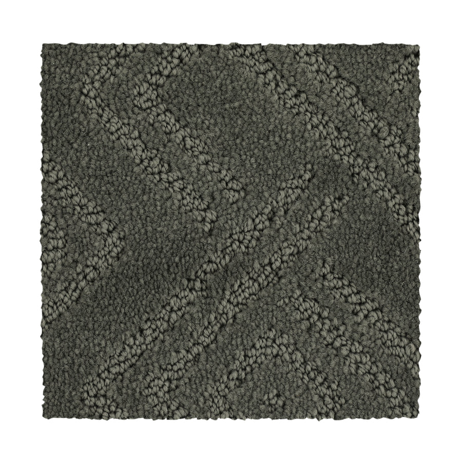 Classic Frame Family Friendly Carpet in Stonework is a durable square sample with a raised geometric pattern, diagonal lines, and textured loops—perfect for family-friendly spaces.