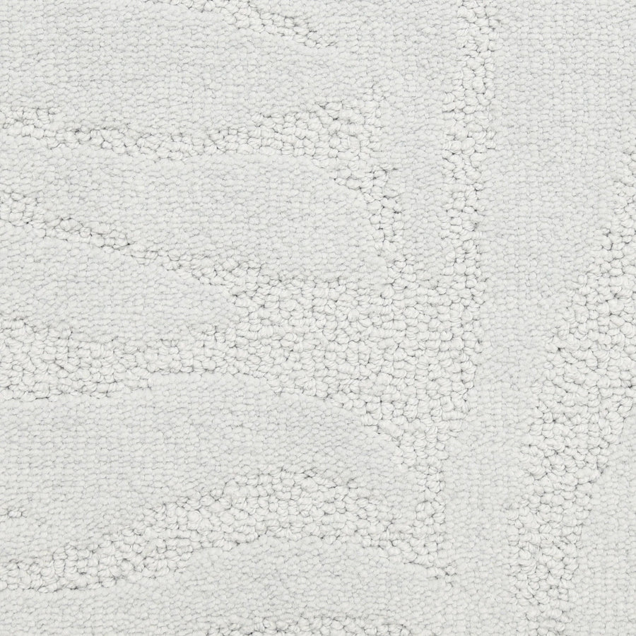 Close-up of Capetown On Trend Carpet in Clifton, showing its off-white, textured surface with a subtle raised leaf-like pattern and soft looped fibers—durable for high-traffic areas and modern interiors.