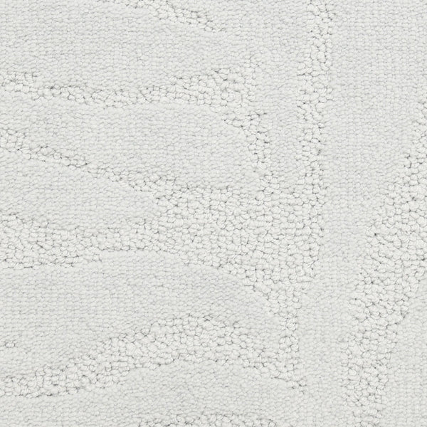 Close-up of Capetown On Trend Carpet in Clifton, showing its off-white, textured surface with a subtle raised leaf-like pattern and soft looped fibers—durable for high-traffic areas and modern interiors.