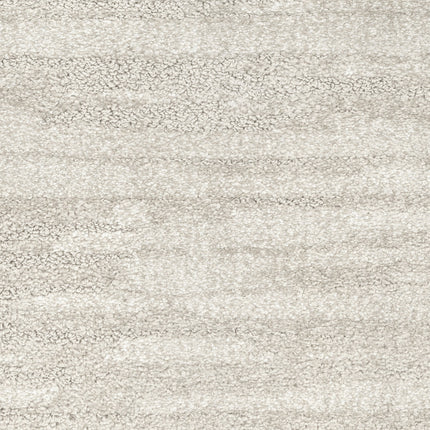A close-up of the Cirrus Berber Carpet in Cloud color highlights its textured, plush surface with subtle horizontal shading—an ideal choice for premium flooring.