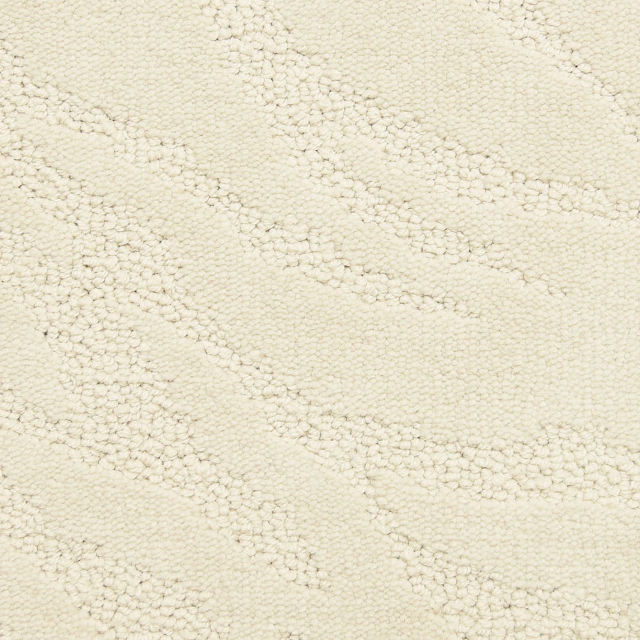 Close-up of Capetown On Trend Carpet in Cloud Land—its cream-colored, textured surface features a subtle wavy pattern of raised and flat areas, offering an abstract style ideal for high-traffic spaces.
