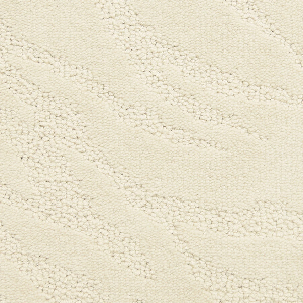 Close-up of Capetown On Trend Carpet in Cloud Land—its cream-colored, textured surface features a subtle wavy pattern of raised and flat areas, offering an abstract style ideal for high-traffic spaces.