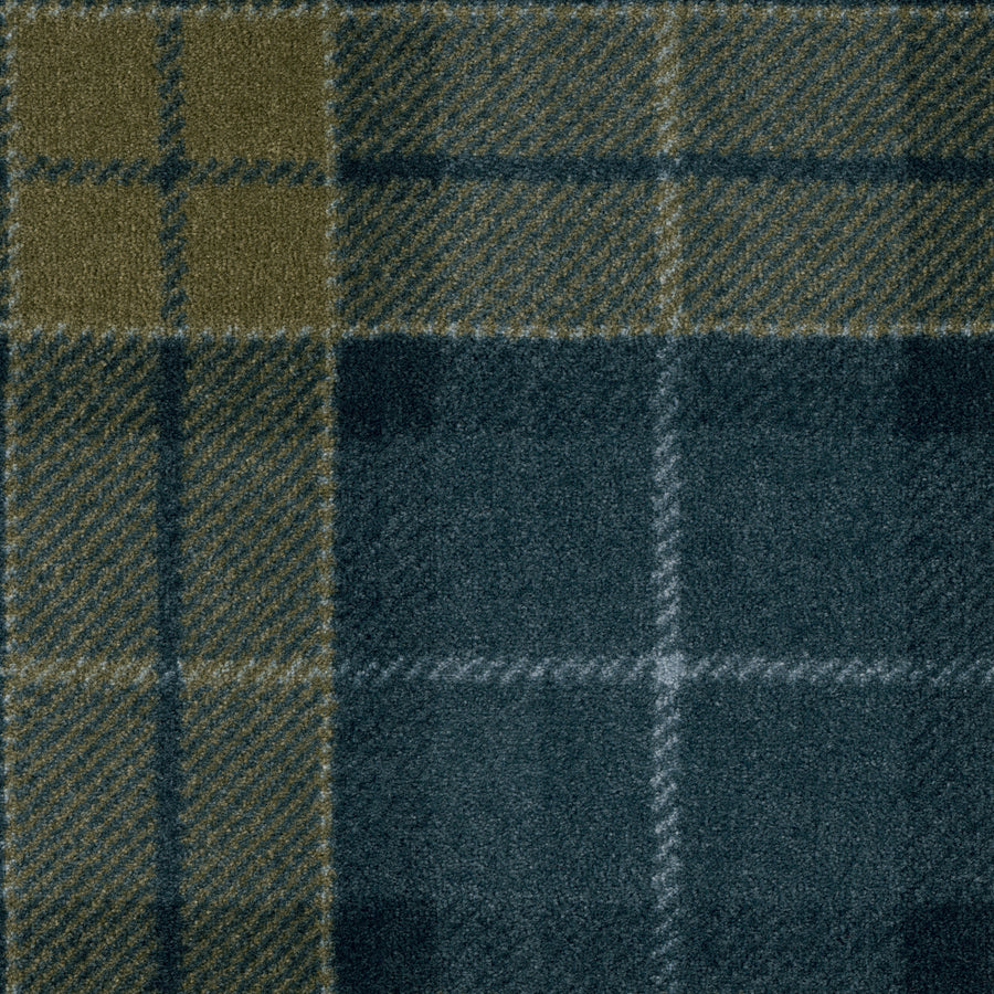 A close-up of Club Royal On Trend Carpet in Midnight color shows intersecting lines of dark green, olive, and blue forming squares and rectangles with a plush pile texture—ideal for stylish interiors.