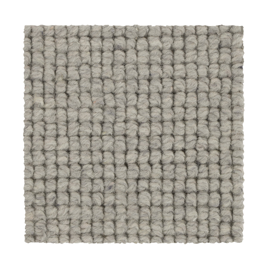 A square sample of Collanmore Berber Carpet in Stardust, featuring a textured, chunky woven loop ideal for high-traffic areas, is shown on a white background.