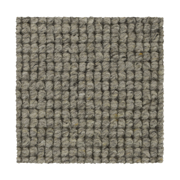 A square sample of Collanmore Berber Carpet in Coastal Mist, featuring a textured gray looped grid pattern—crafted from thick yarns in parallel rows, ideal as premium flooring for high-traffic areas.