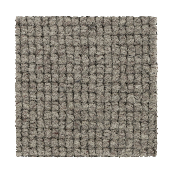 Square sample of Collanmore Berber Carpet in Caspian Gray, showcasing a textured looped grid pattern with tightly woven fibers. Perfect as premium flooring for high-traffic areas. Displayed against a white background.
