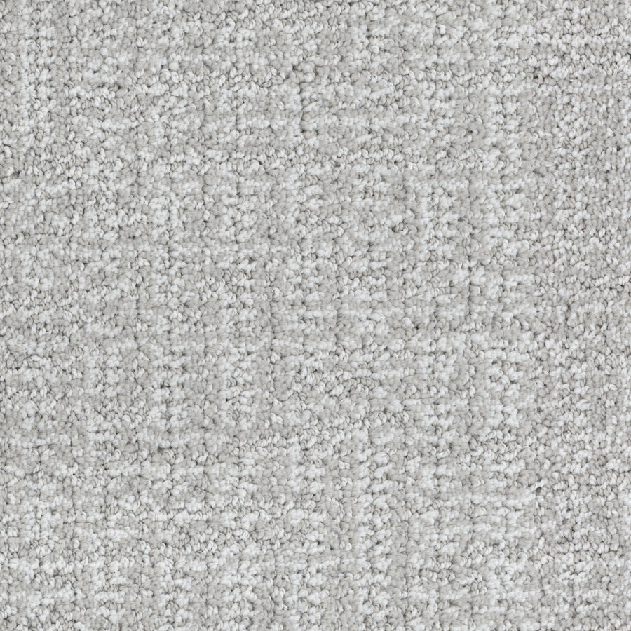 Close-up of Connection Pet Friendly Carpet in light gray with a subtle checkered cut and loop texture. Soft, densely packed fibers create a plush, cozy surface ideal for any space, while its design suits pet-friendly homes.