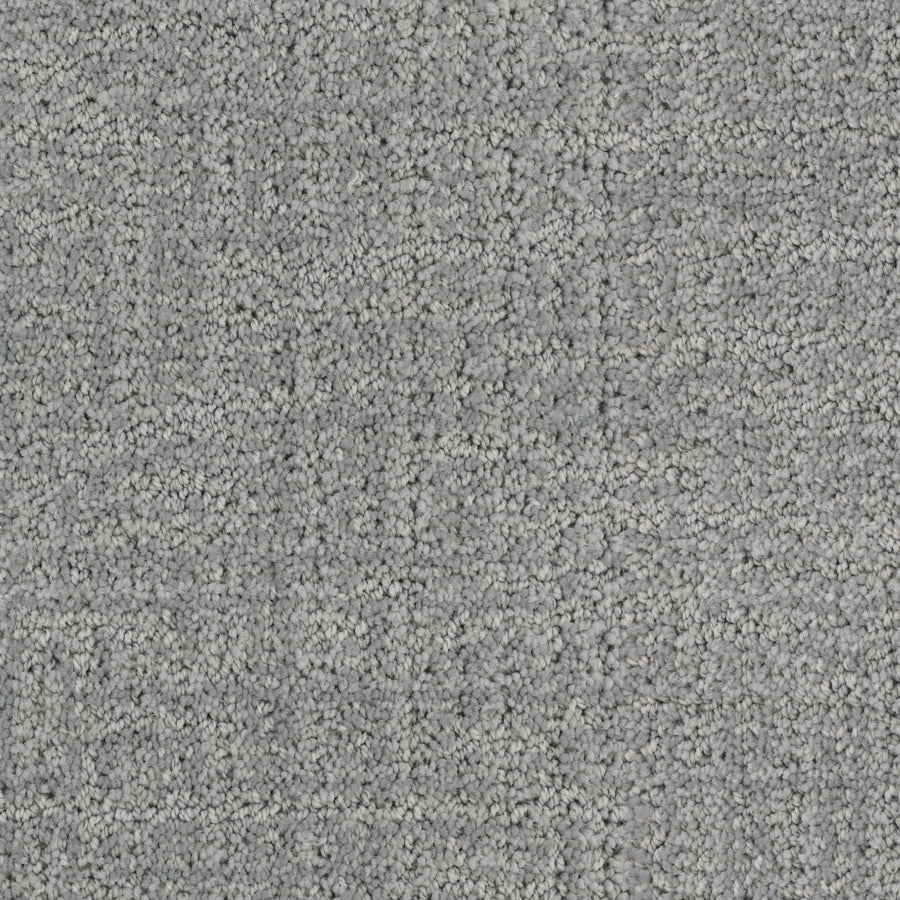 Close-up of Connection Pet Friendly Carpet in gray, showcasing a subtle square pattern and cut-and-loop texture. The surface is soft and uniform, with varied gray shades for stylish, pet-friendly comfort.