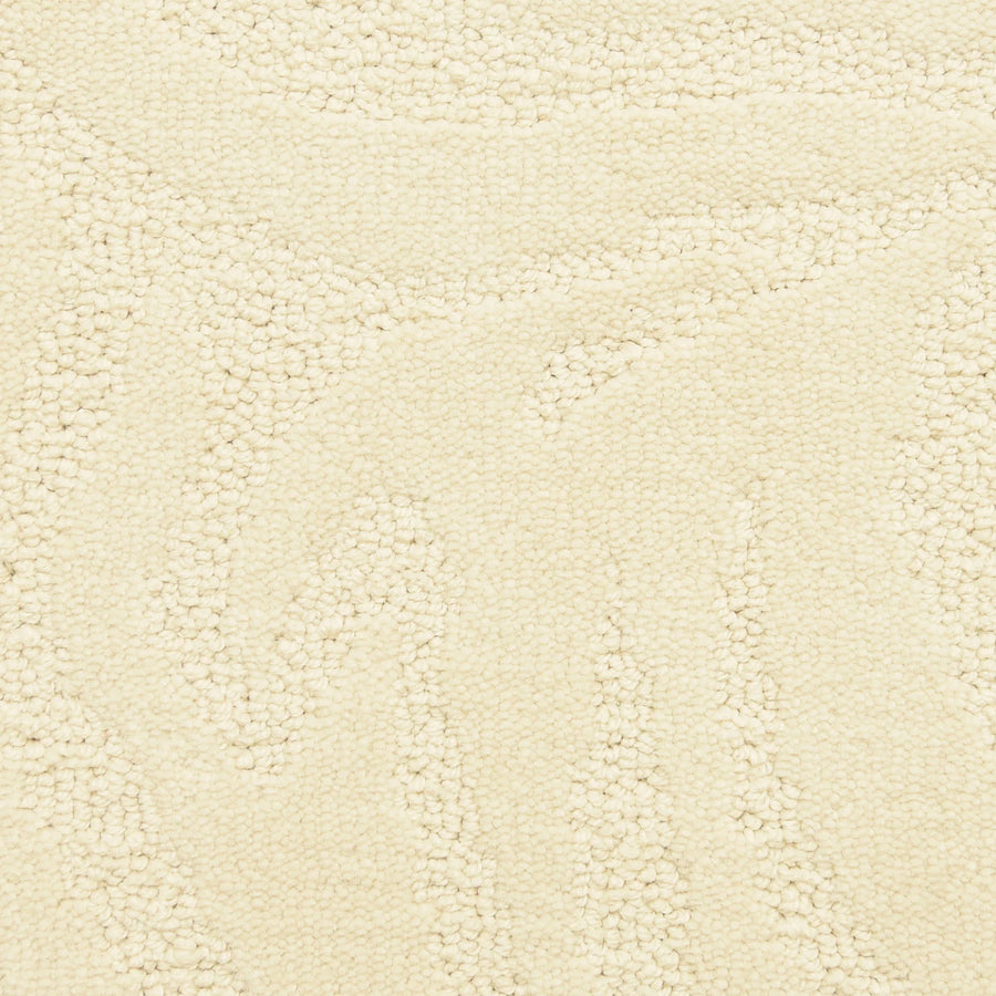 Close-up of Capetown On Trend Carpet in Constatia—a textured, off-white luxury carpet featuring raised swirling patterns and rounded loops. Its soft, plush surface adds comfort and style to high-traffic areas.