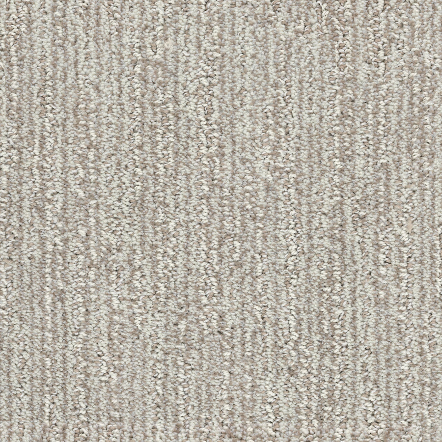 Close-up view of the Contentment Pet Friendly Carpet in light beige, showcasing its soft, looped pile, subtle linear pattern, and stain-resistant surface.