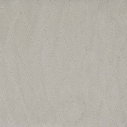 Absolute Berber Carpet in Convincing features a soft, light beige hue with a subtle diamond pattern from raised and lowered textures. Durable and ideal for high-traffic areas, it offers a geometric look with evenly spaced, stitched-like diamonds.