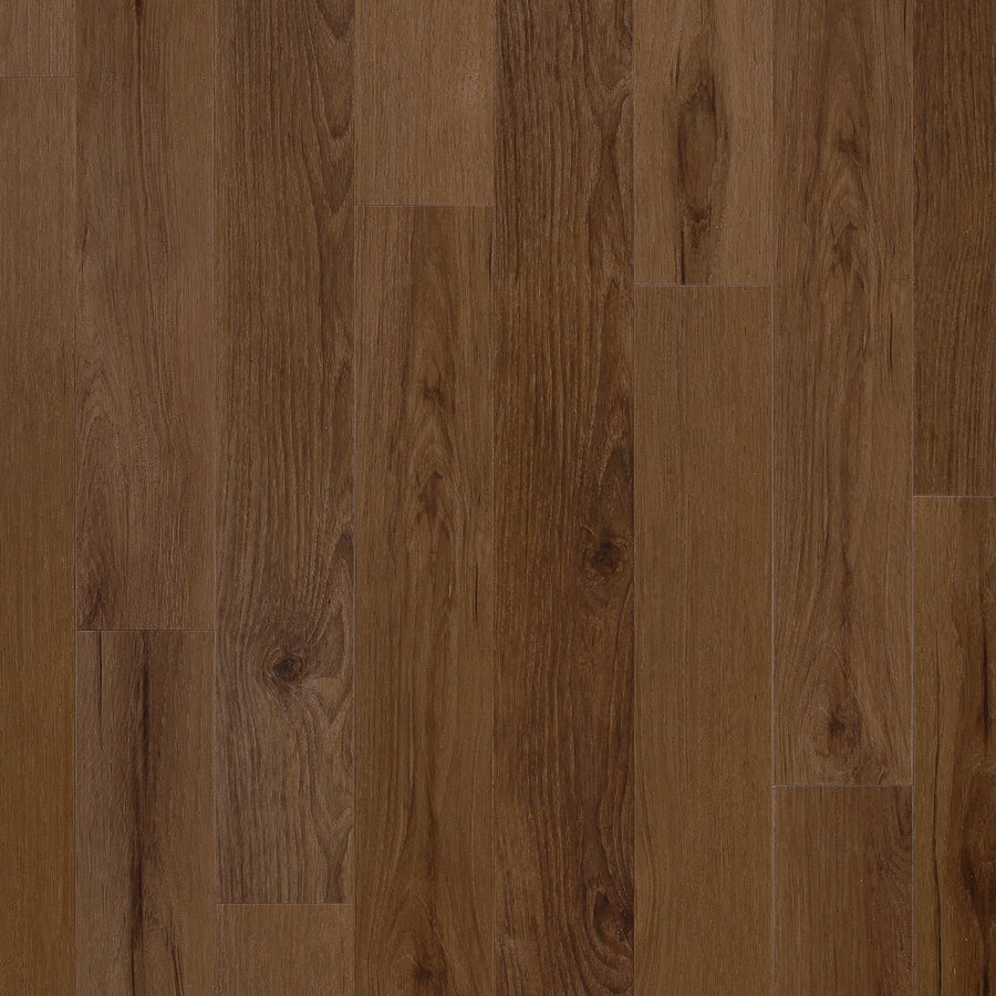 Close-up of Coretec Originals Classics Vinyl flooring with narrow, medium brown planks featuring authentic wood grain patterns and subtle knots—showcasing the realistic look and durability of this luxury vinyl option.